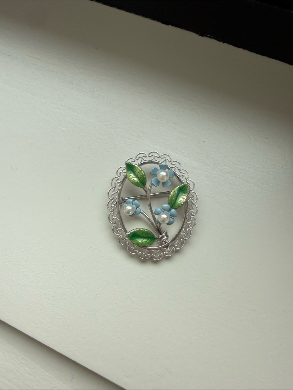 Vintage Floral Oval Brooch with Blue Flowers and Green Leaves